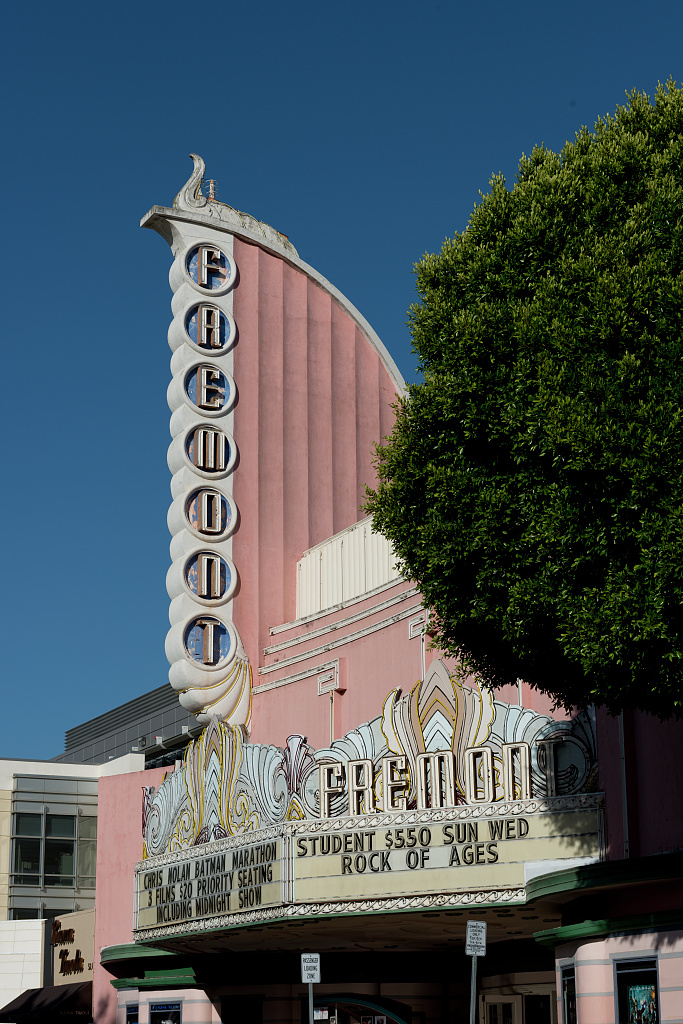 Fremont Theatre's vertical Art Deco lettering on a pink facade